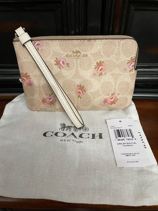 Coach Handbags - Coach Pink Floral corner zip Wristlet nwt